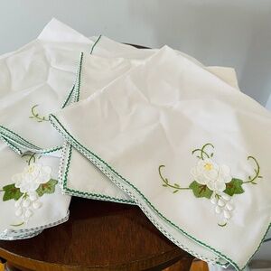 Handmade white cotton napkins with embroidered floral and grape motifs